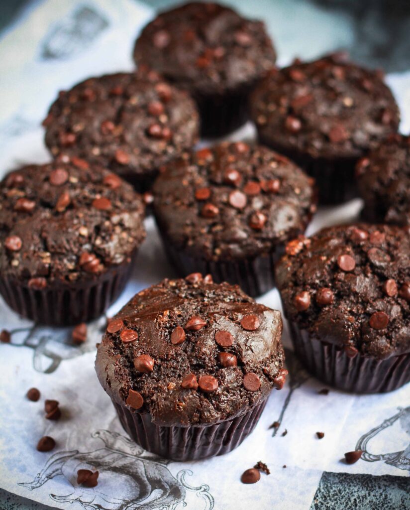 Eggless Chocolate Protein Muffins on a surface.