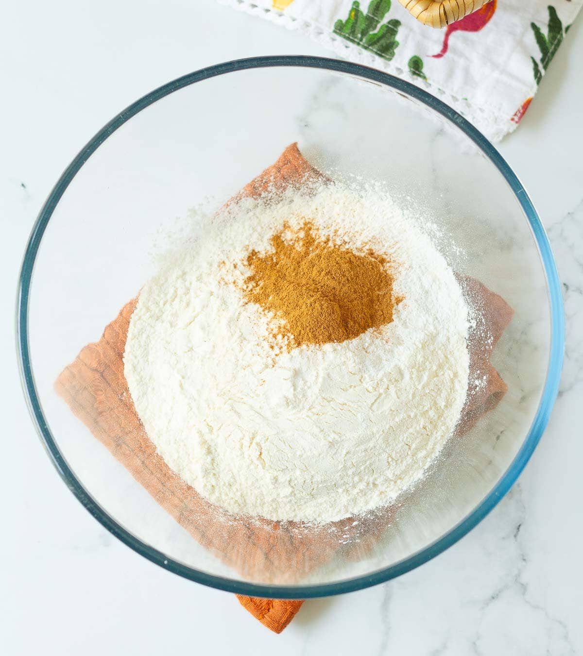 Dry ingredients for making cake in a mixing bowl.