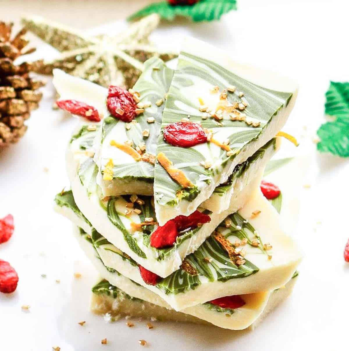 A stack of white chocolate matcha bark pieces.