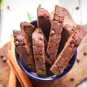biscotti in a mug with ingredients around.