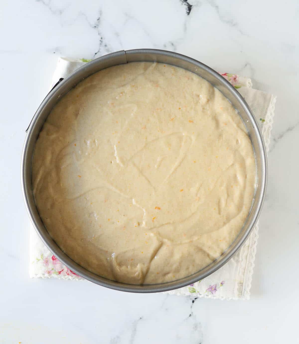 Cake batter in a cake pan.