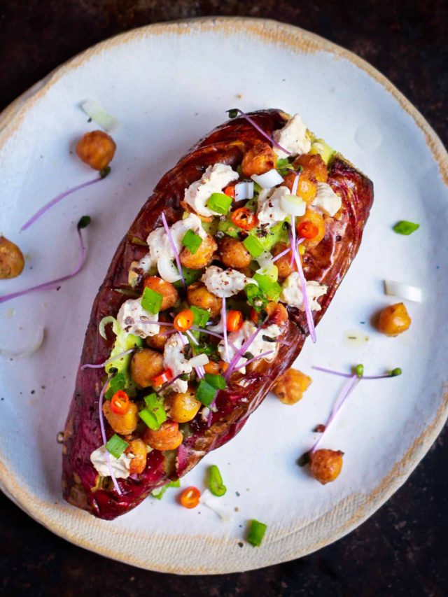 Loaded baked sweet potato on a plate.