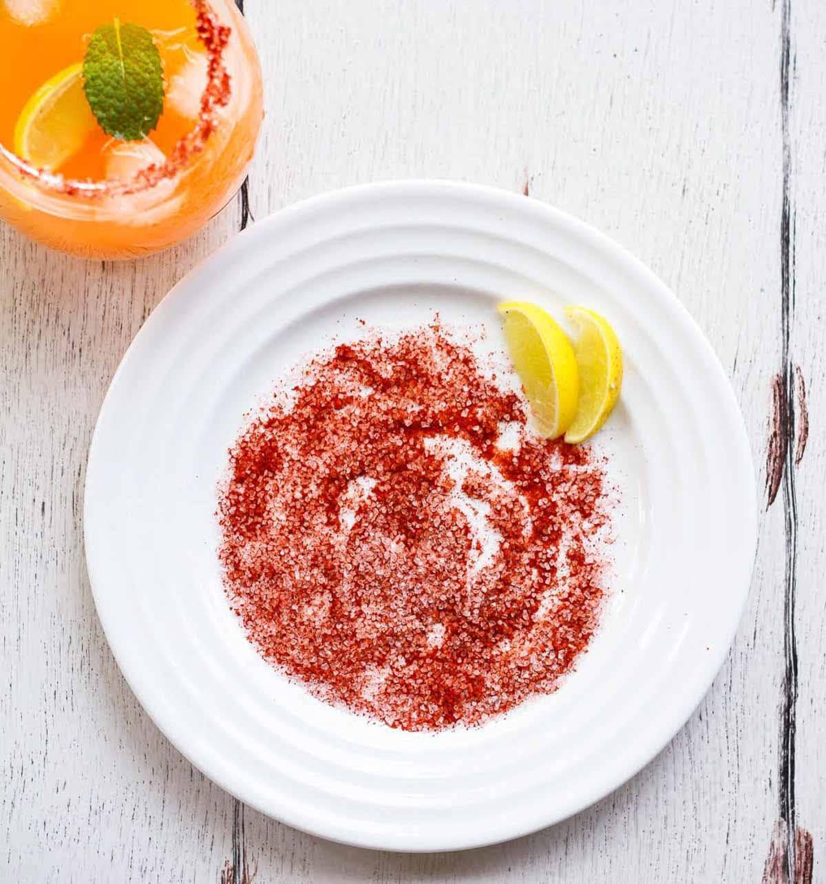 A white plate with paprika and salt mixture.