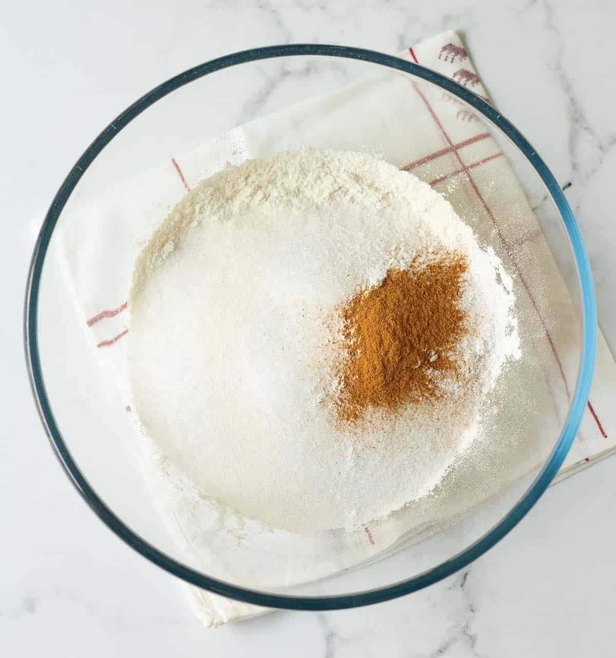 Dry ingredients for a cake in a mixing bowl.