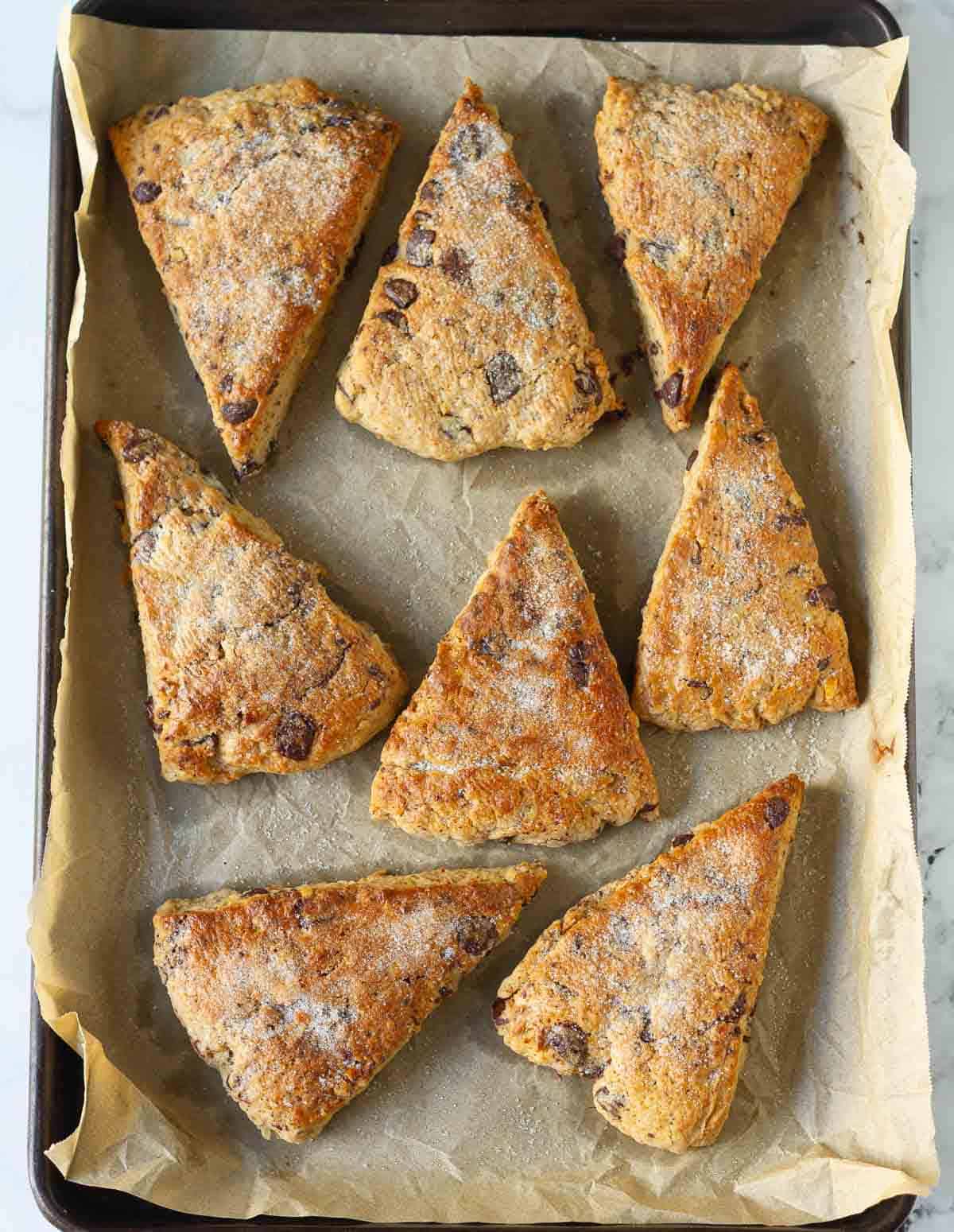 Baked banana scones on parchment paper.