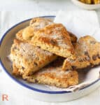A bowl filled with banana scones with walnuts and chocolate chips.