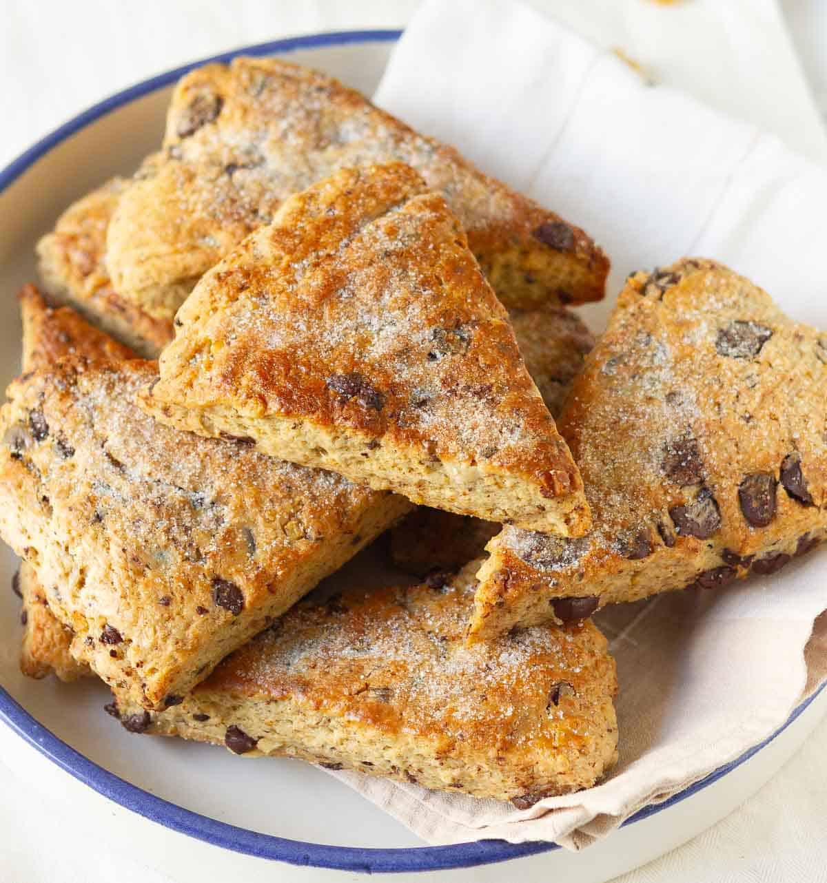 Scones with chocolate chips and walnuts in a bowl.
