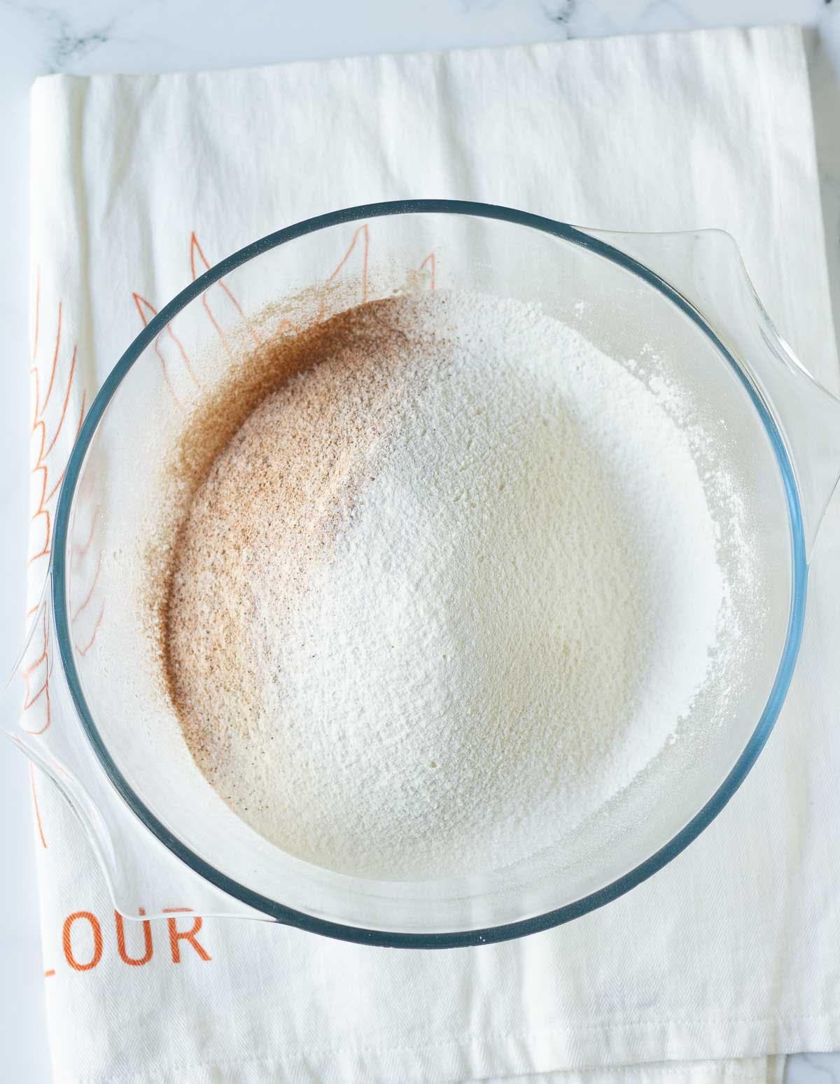 Sifted dry ingredients in a mixing bowl.