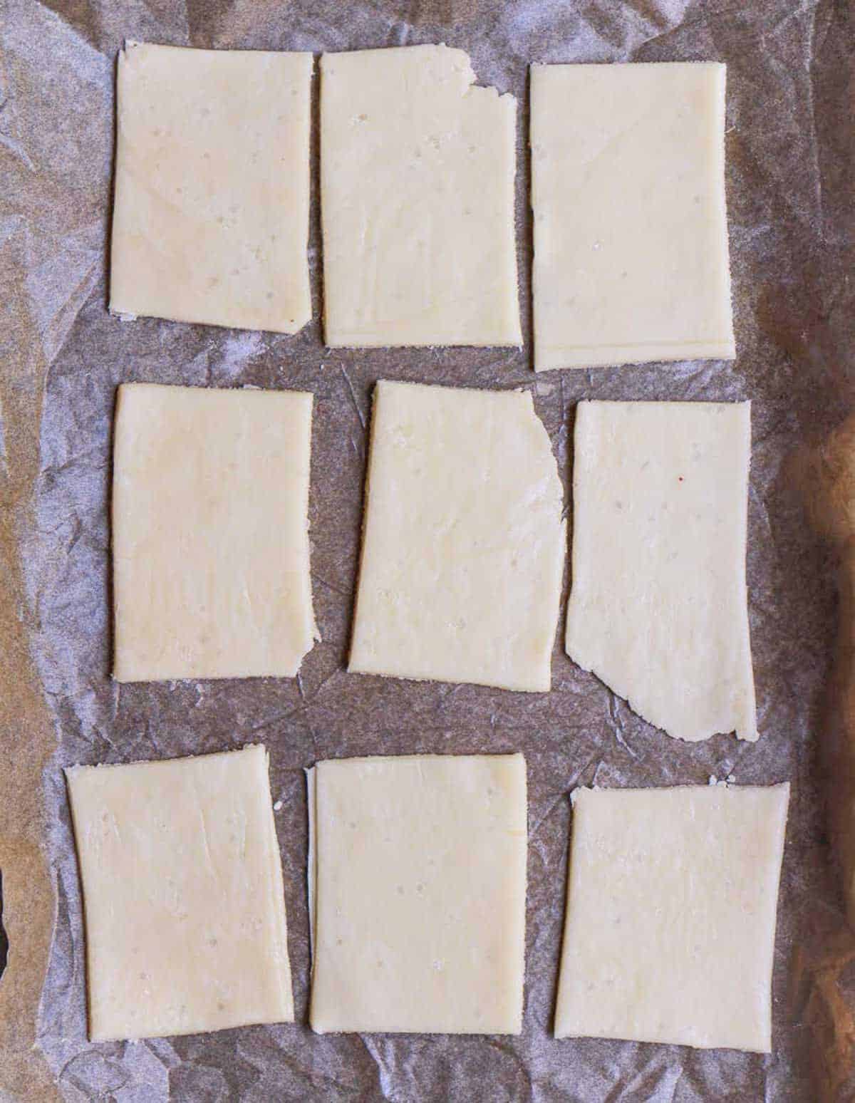 dough cut into 9 rectangles.