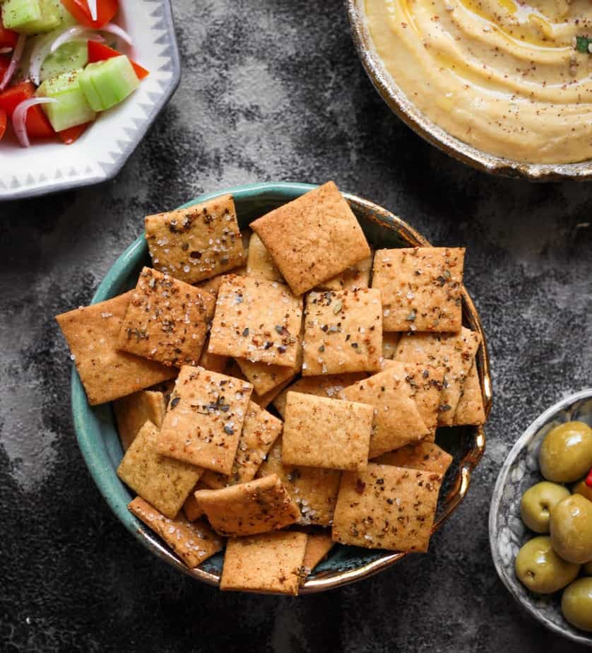 Sourdough Crackers with hummus, olives and salad on the side.