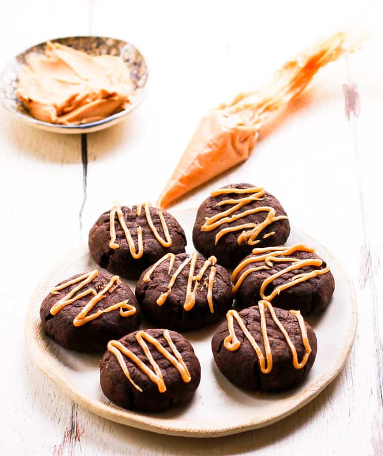 Chocolate Peanut Butter Cookies with drizzle of peanut butter glaze.