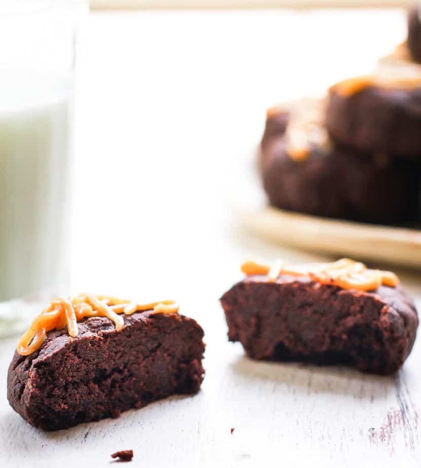 chocolate peanut butter cookie cut in half to show fudgy texture.