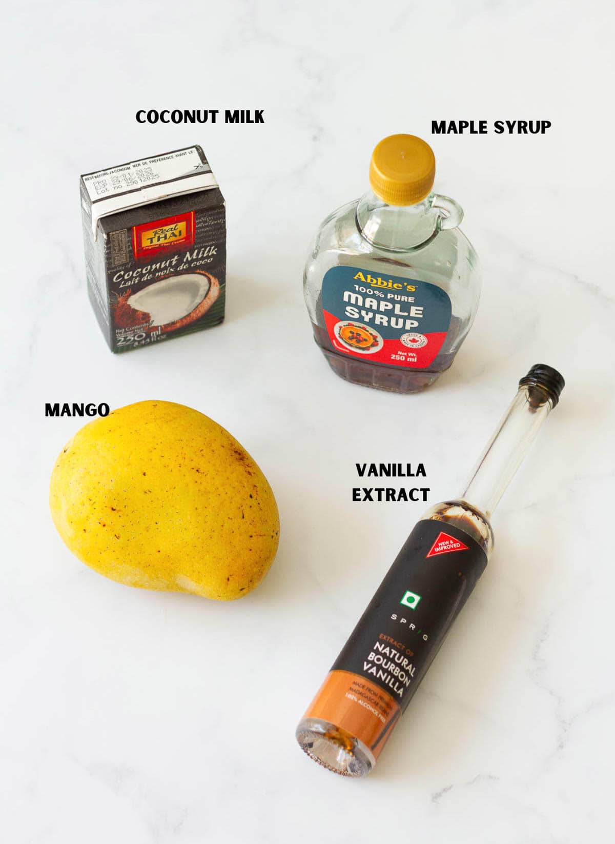 Ingredients for making coconut mango popsicles.