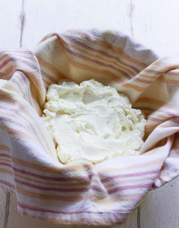 Yogurt and salt mixture on a kitchen towel.