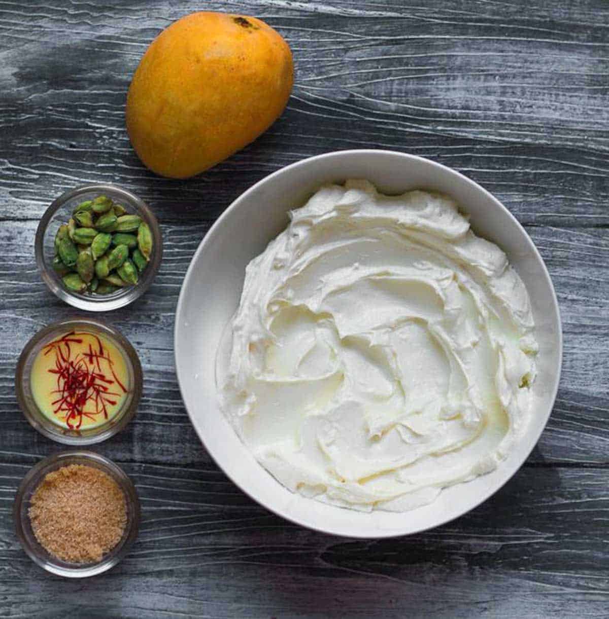Ingredients for making mango shrikhand.