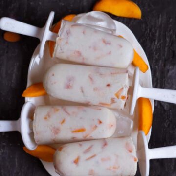 Almond Peach Popsicles on a serving tray.