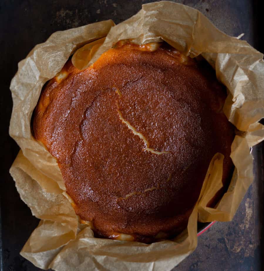 Baked basque cheesecake in a cake tin.