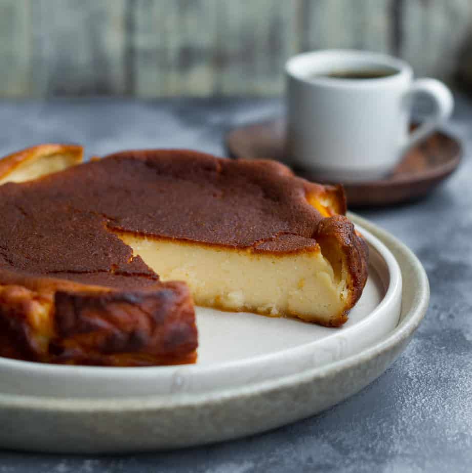 basque cheesecake with a slice taken out.