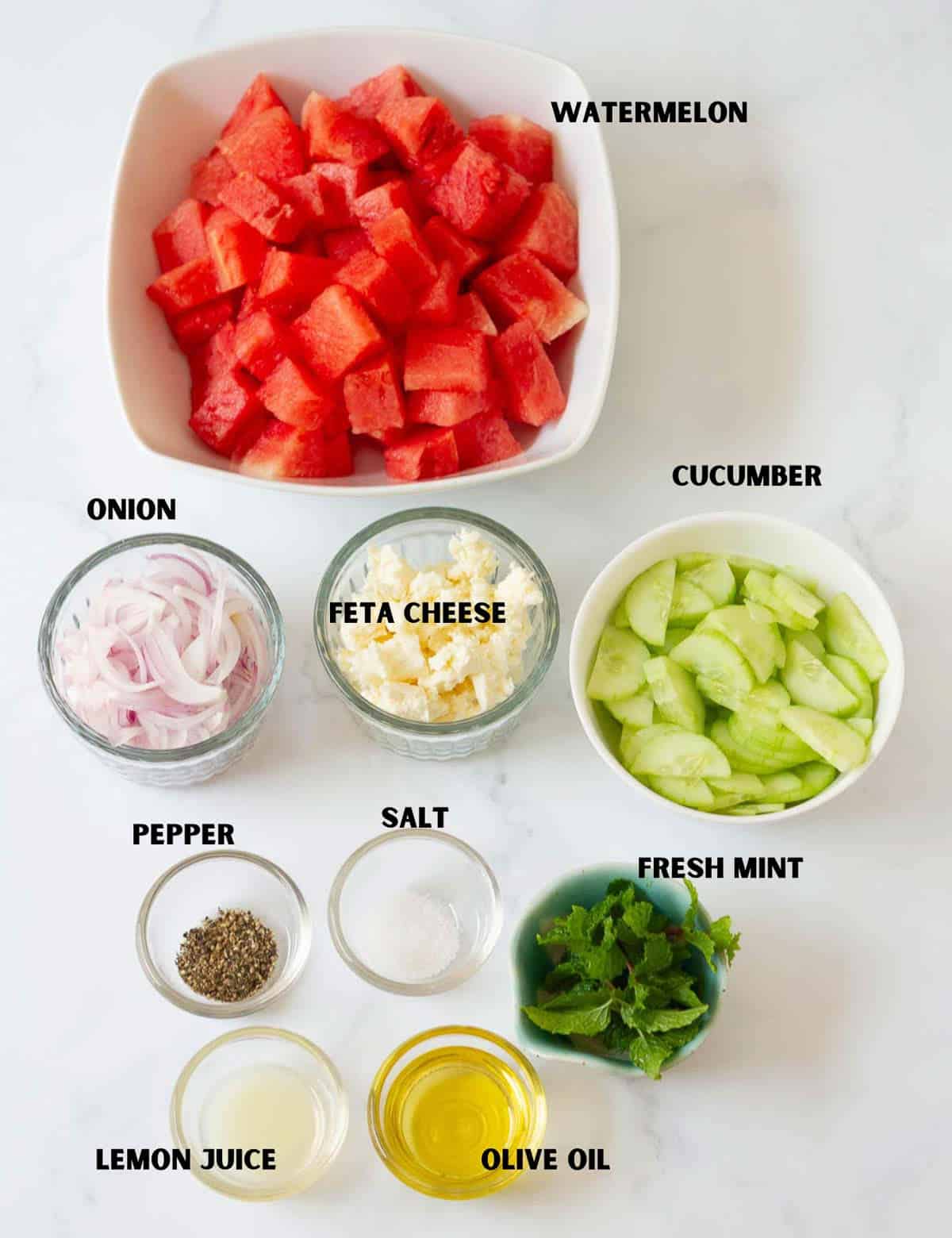 Labelled ingredients for making feta and watermelon salad.