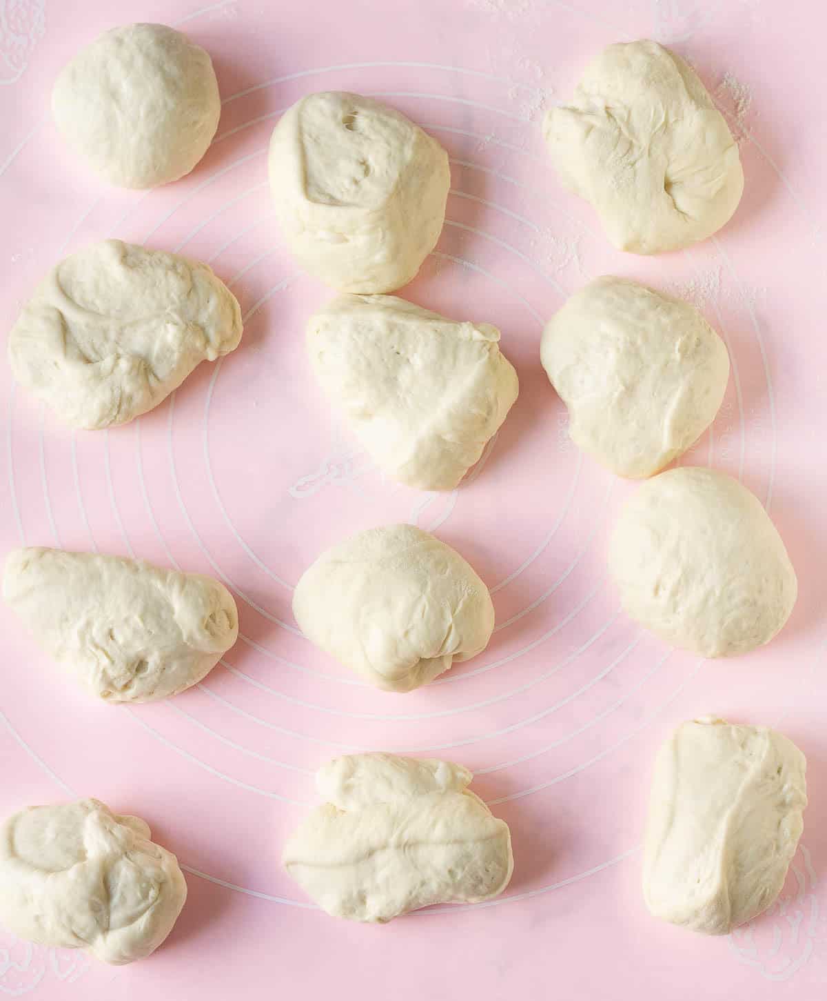 pretzel dough divided into 12 equal pieces.