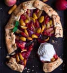 A galette with fruits and a scoop of ice cream on one piece.