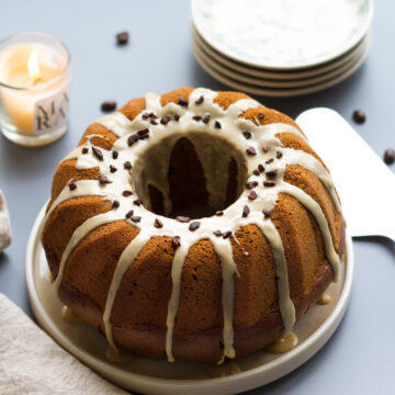 Espresso Bundt Cake on a serving platter with a cake server on the side.