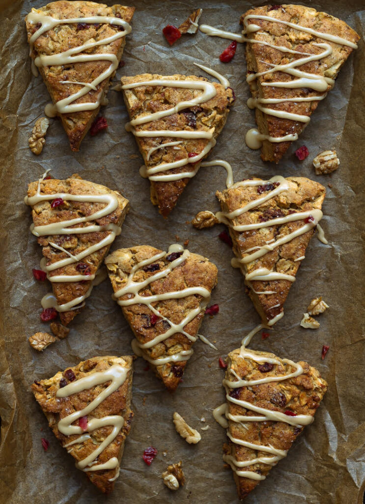 Apple scones on a parchment lined tray.