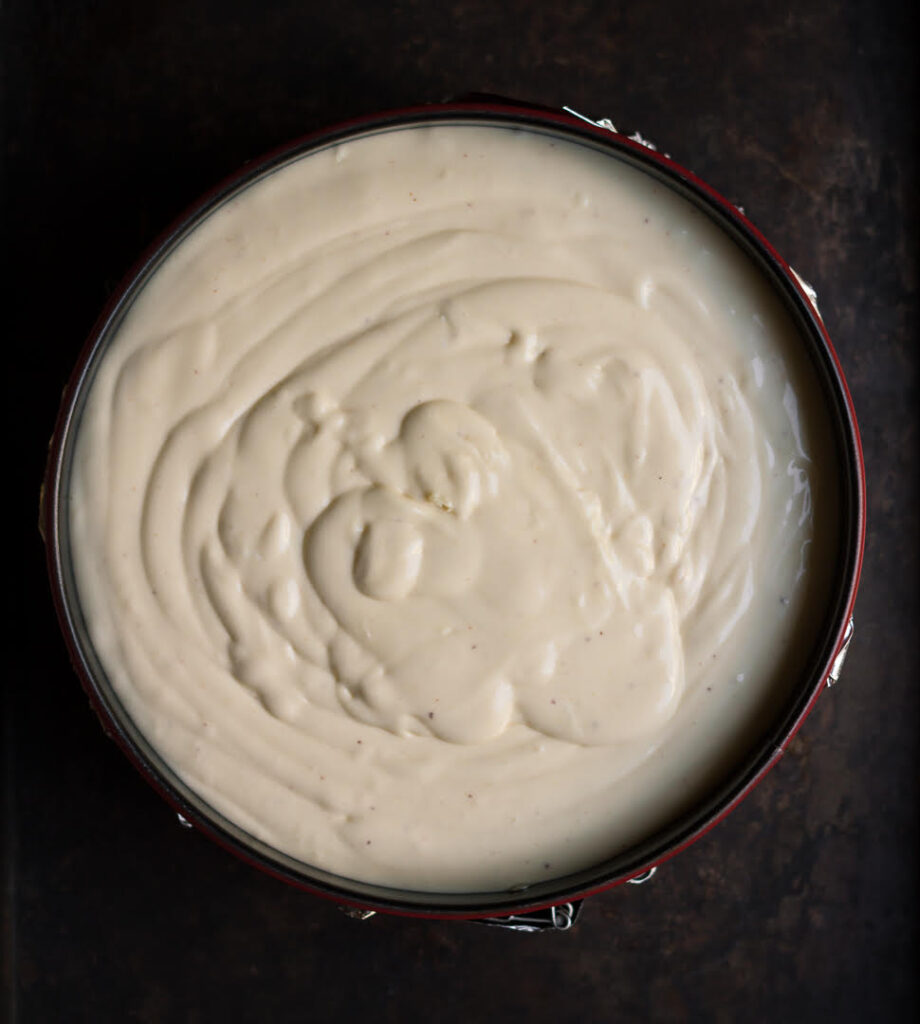 Cheesecake batter in a cake tin.