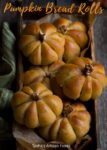 Pumpkin Bread Rolls in a wooden tray.