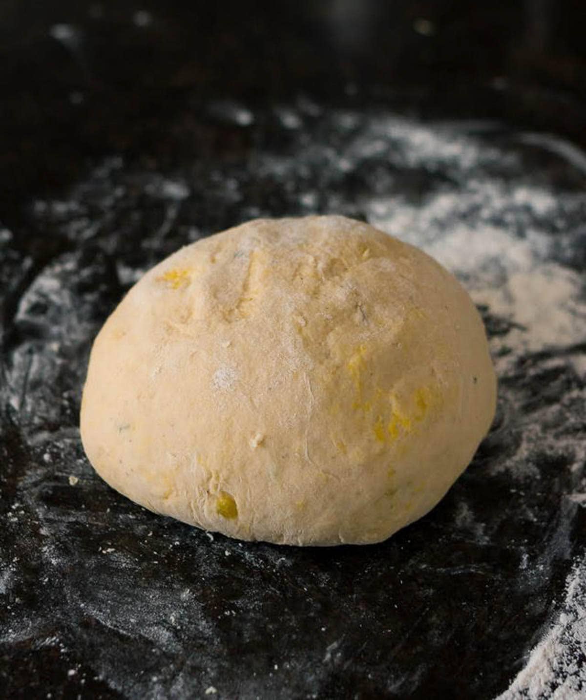 dough for making pumpkin rolls on a floured surface.