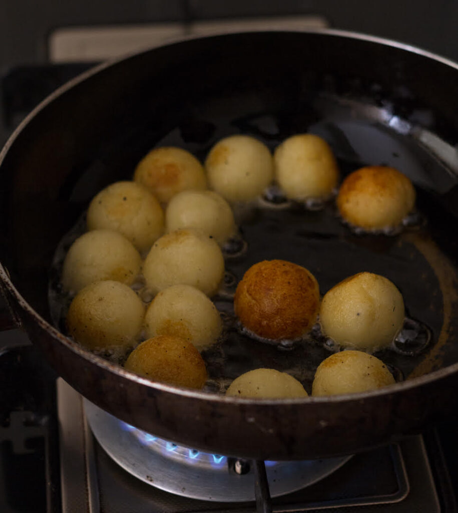 Frying the dough balls for Easy Homemade Gulab Jamun | How to make gulab jamun