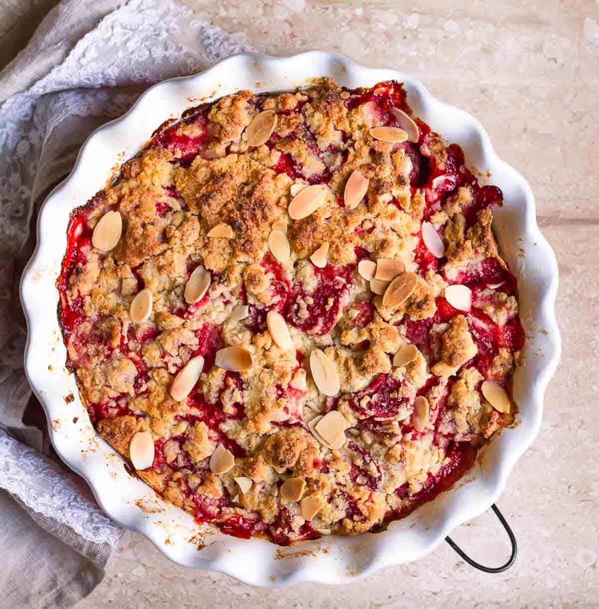 Baked strawberry dump cake in a baking dish.