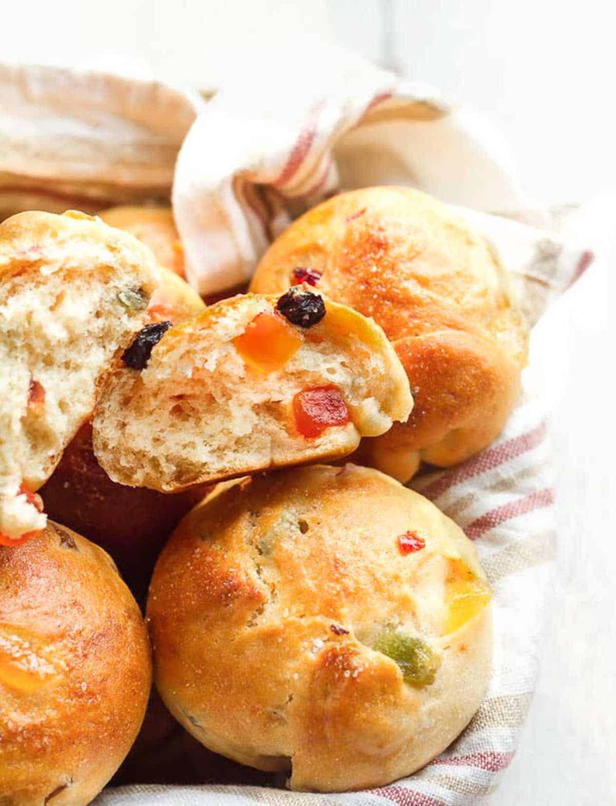 2 halves of a bun in a basket to show the fluffy interior.