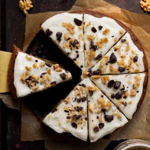 Sliced coffee banana cake on parchment paper.