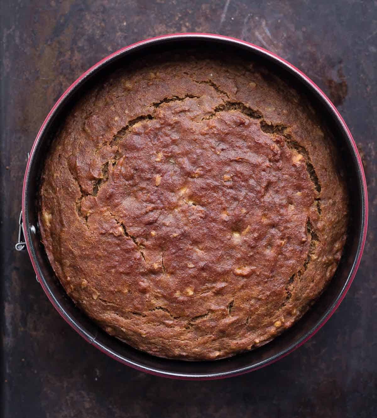 Baked cake in a cake tin.