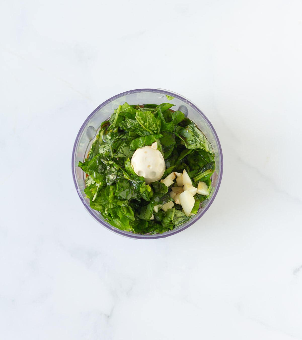 Ingredients for salad dressing in a food processor jar.