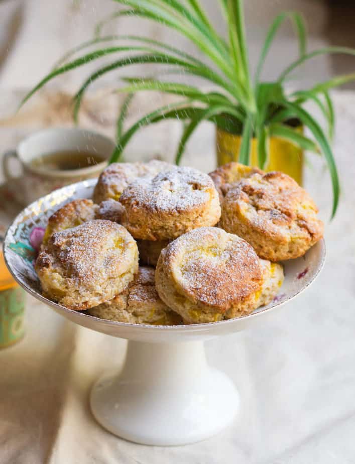 Sprinkling with icing sugar Mango Coconut Scones | Easy Eggless Mango Scones Recipe