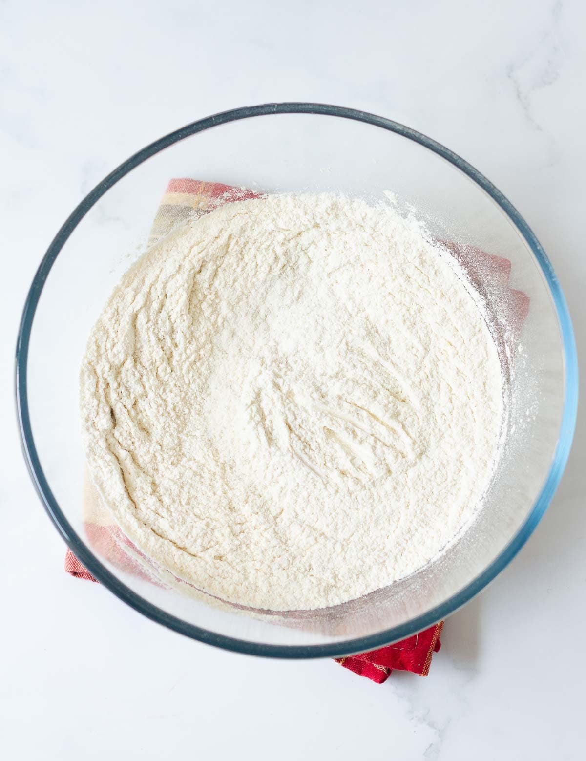 Dry ingredients in a glass mixing bowl.