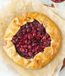 Rustic Cherry galette on parchment paper.