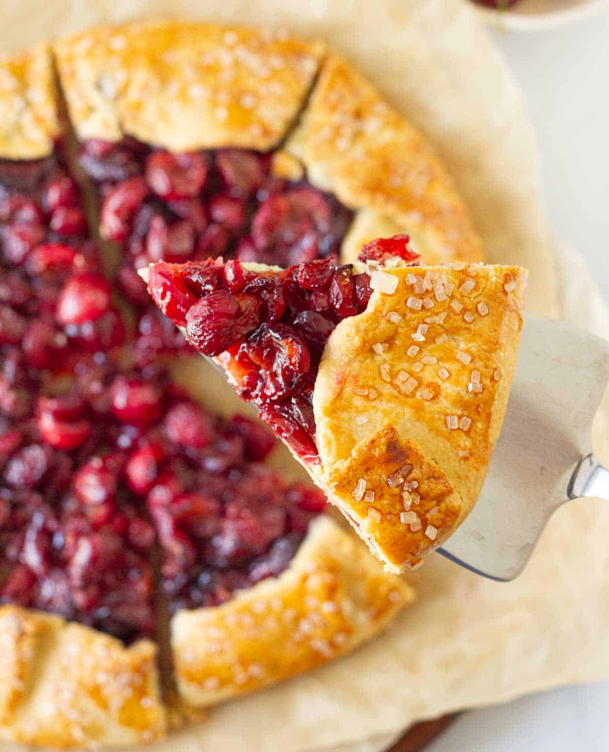 A slice of pie on a pie server.