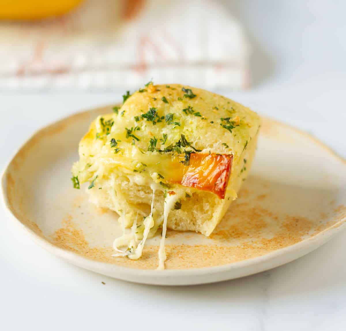 A piece of bread on a small plate.