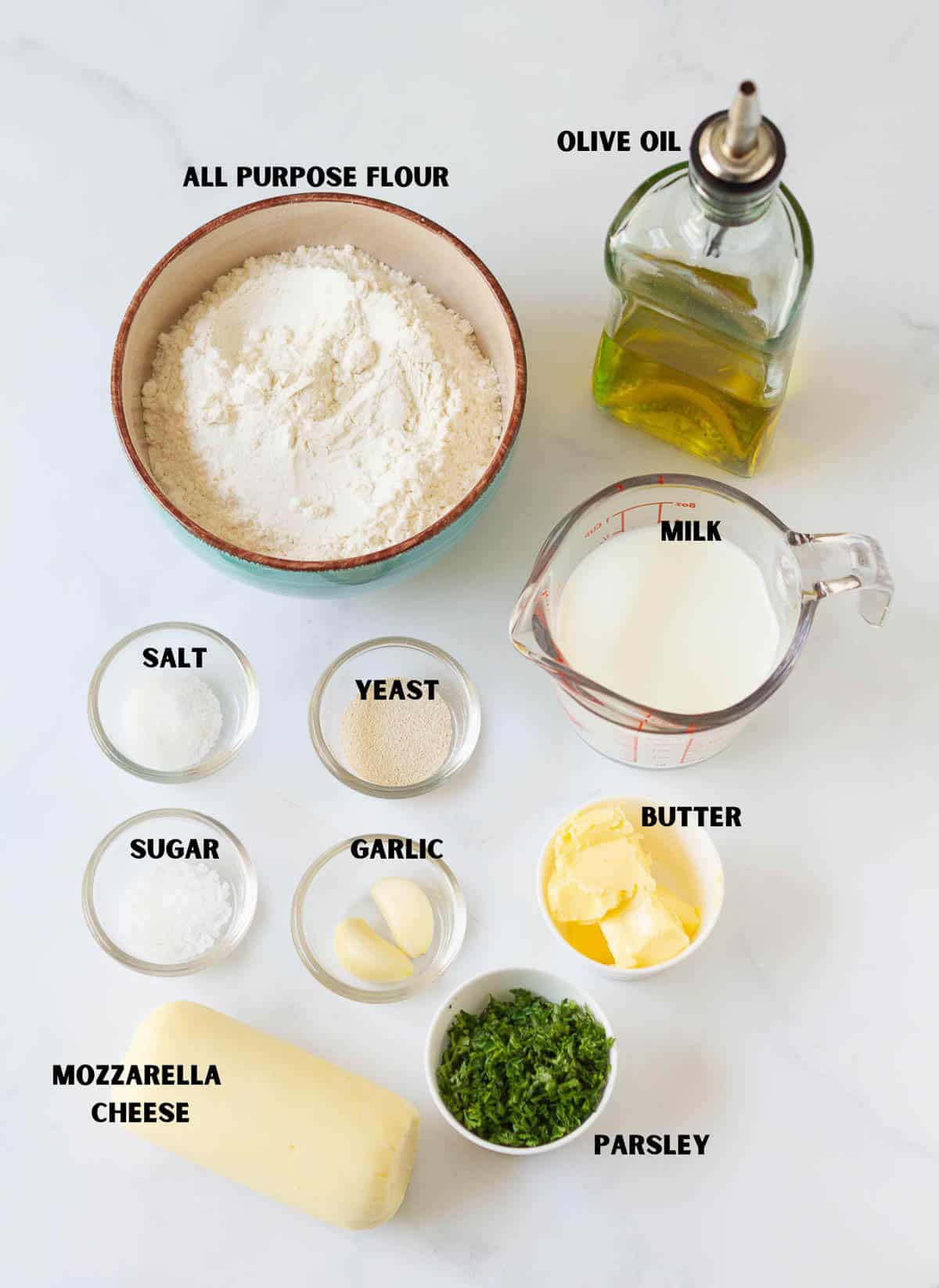 Labelled ingredients for making homemade garlic cheese bread.