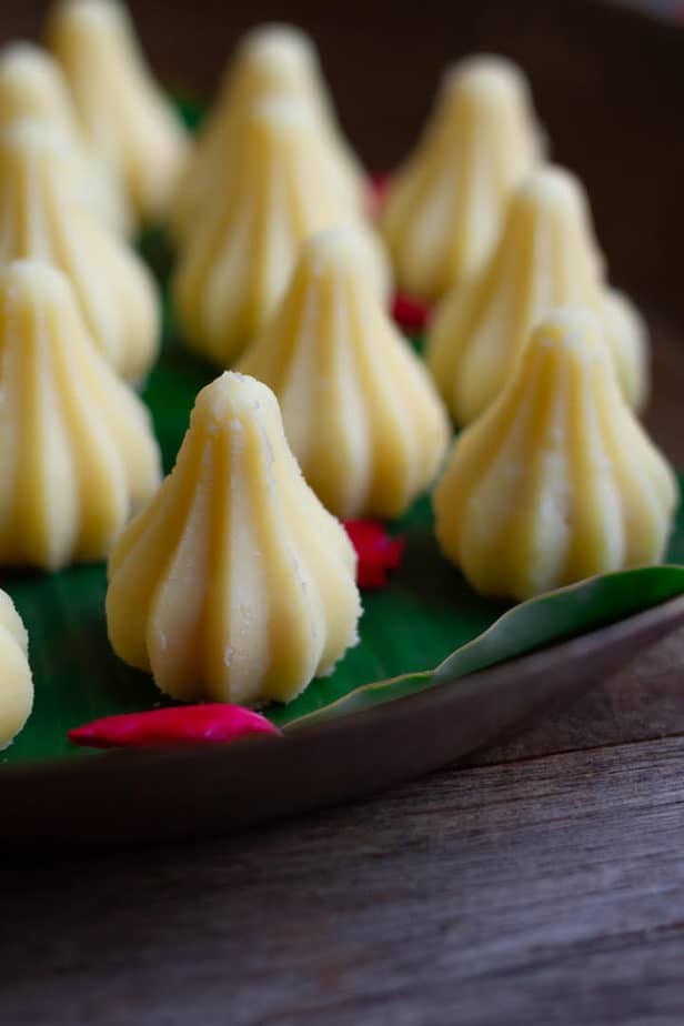 Coconut Mawa Modaks in a brass platter.