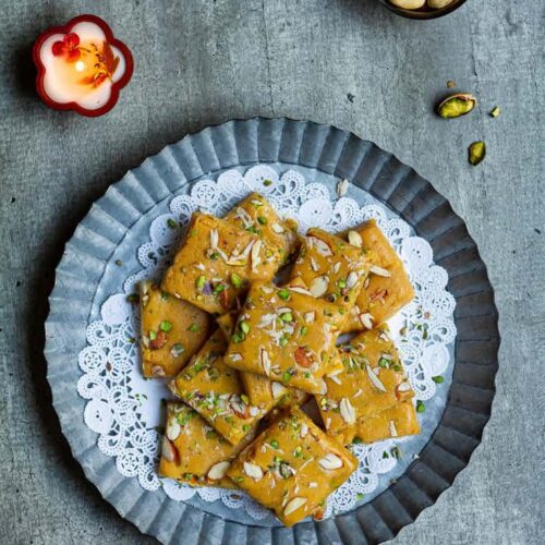 Besan Burfi with Condensed Milk on a serving platter.