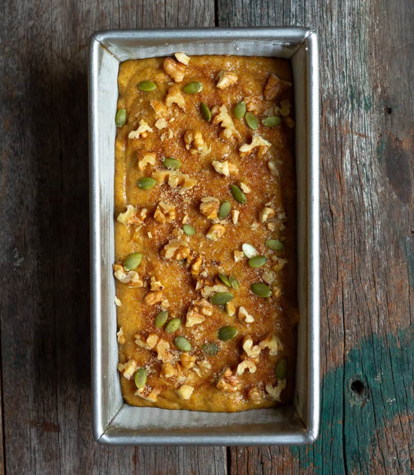 Pumpkin bread batter in a cake pan.
