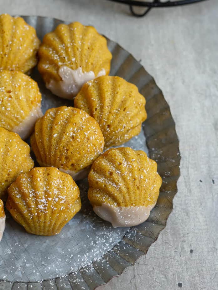 madeleines with glaze and icing sugar dusting.