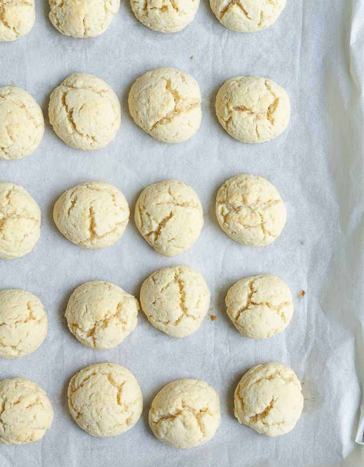 baked cookies on a parchment-lined baking tray.