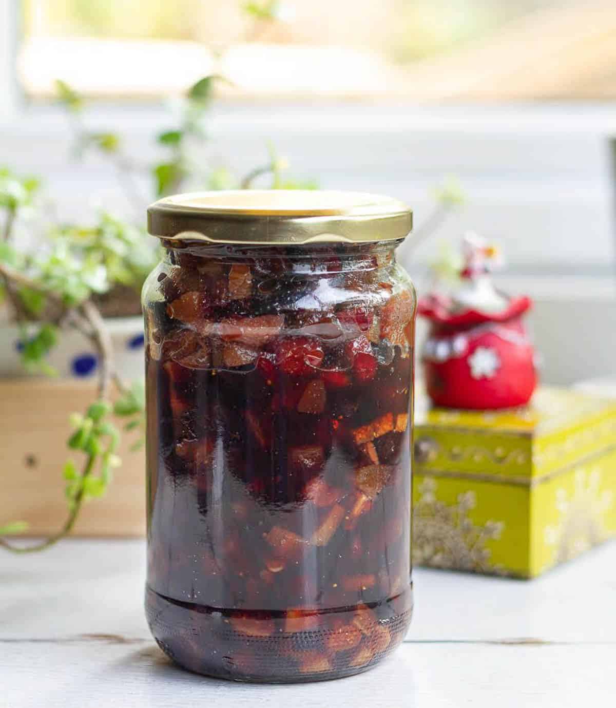 fruits soaked in alcohol in a glass jar.