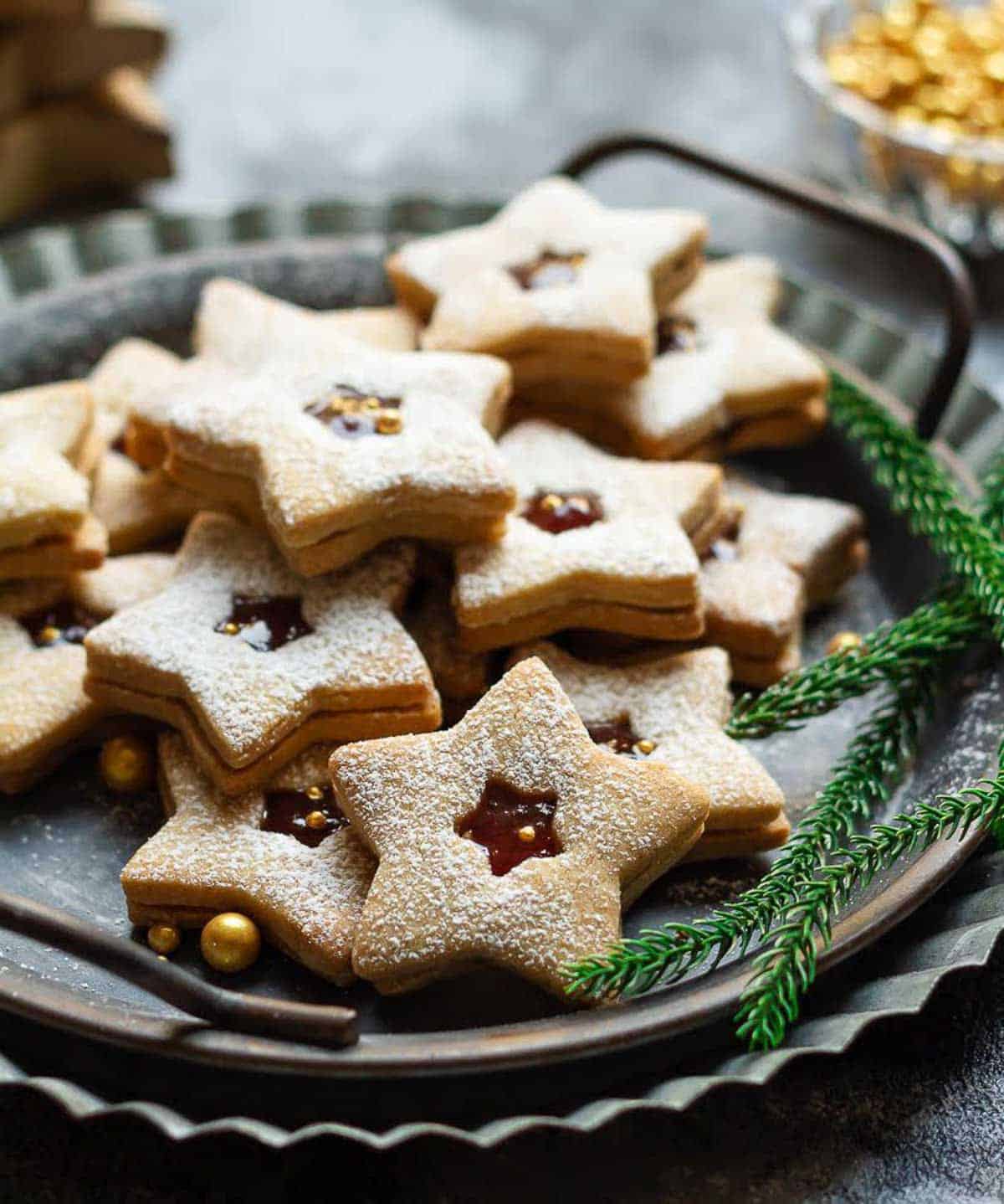linzer cookies in a serving tray.