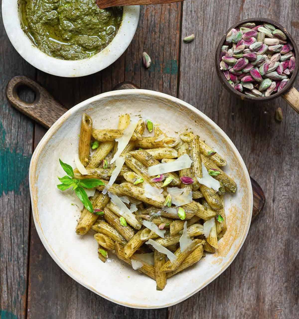 A plateful of pasta tossed with pesto.